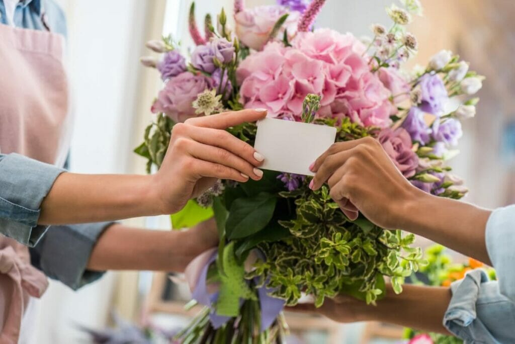 A colorful bouquet and a blank flower card