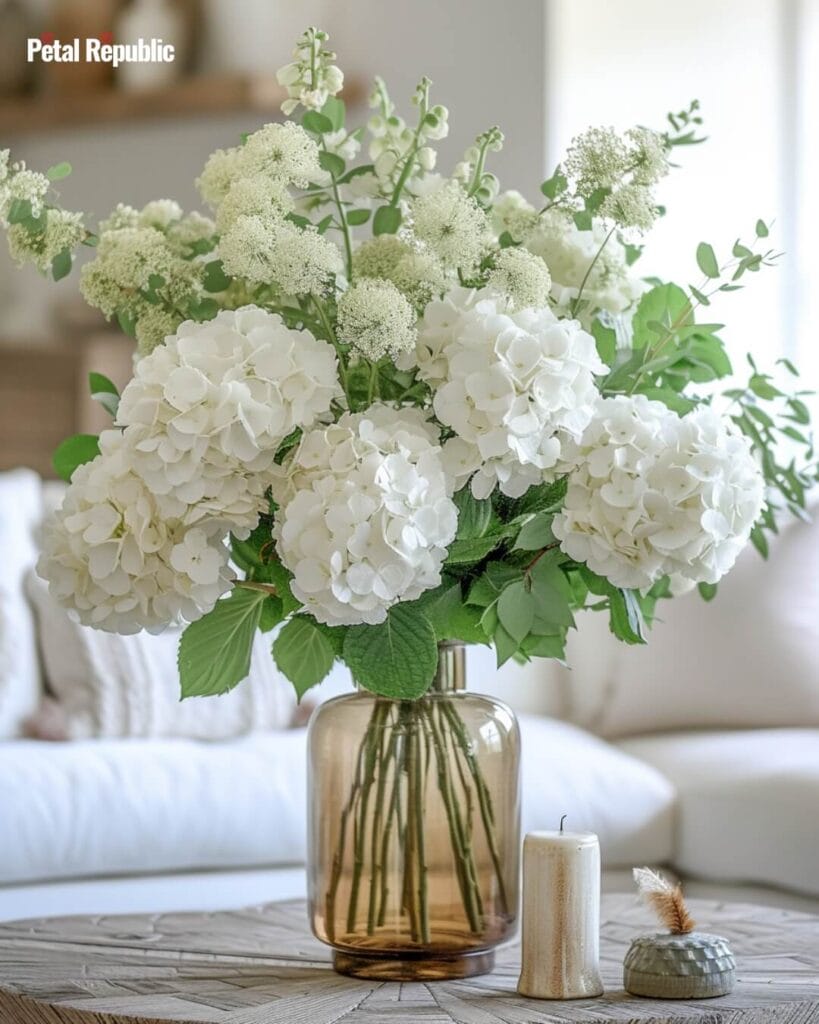 A vase filled with fresh cut white hydrangeas