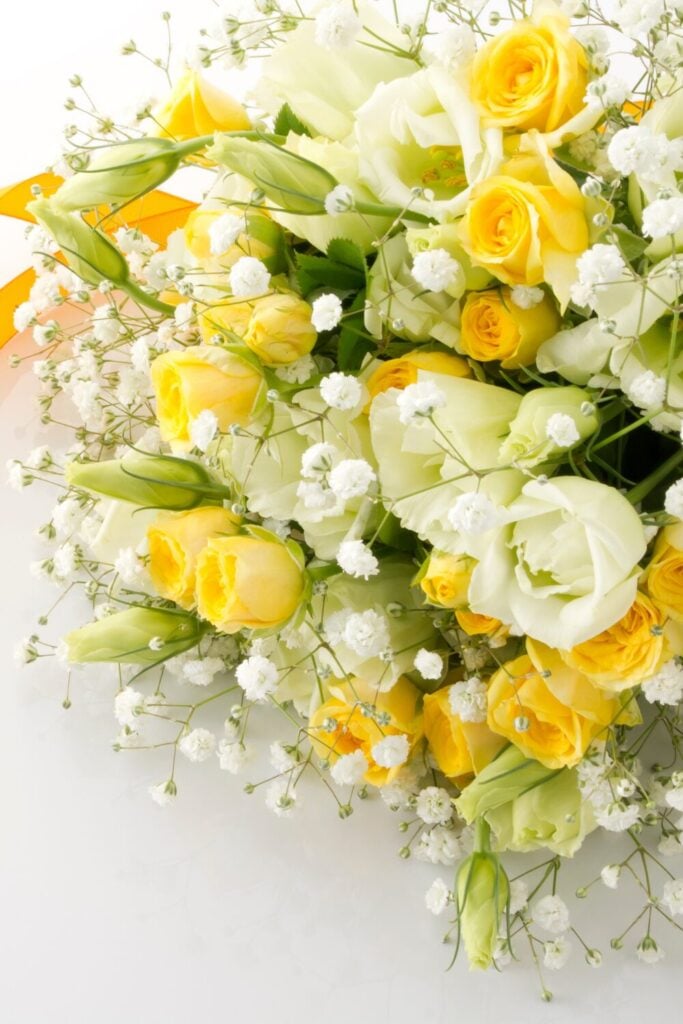Yellow and cream wedding bouquet with roses, lisianthus and baby's breath